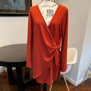 Wrap Dress in Rust/Orange color. Size Medium
